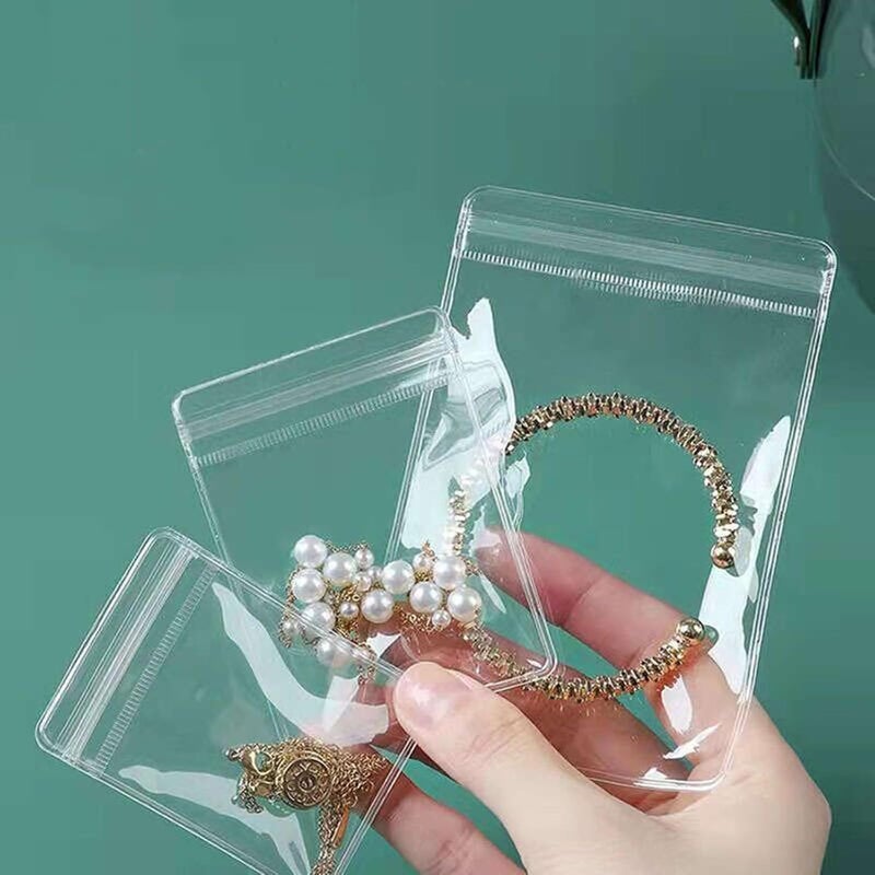 Aeojoor Small Plastic Bags, 100 Pcs Mini Baggies, Clear Plastic Jewelry Thick Self Sealing PVC Bags, Resealable Poly Baggies for Pill, Beads, Screws, Packaging (4.3x4.3"） - Image 1